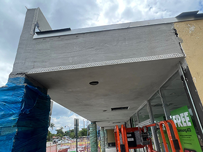 Man repairing stucco wall